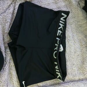 Black DRI-Fit Nike Pro athletic shorts